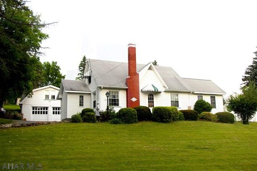 This beautiful 3 bedroom 2 1/2 bath home is located in a quiet area of Logan Township on just over 4 acres of land. You will find built in shelves, hardwood flooring, a sunroom and many other charming features. The master is on the first floor with 3/4 bath and 2 closets. Outside is a private in-ground swimming pool, a large 2 car garage and acres of land with an abundance of fruit trees. Above the garage is a finished 1 bed/1 bath apartment perfect for guests/rental!