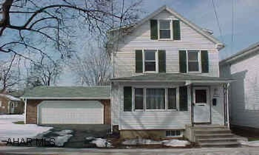 Nice home, move in condition. Nice eat-in kitchen with enclosed porch which can be family room in back of house. 2 car garage attached and 1 car detached garage . New windows, sidewalk. Home warranty included!