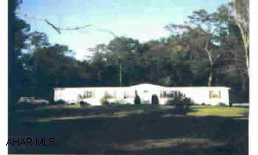 Gorgeous private setting, surounded by woods, one acre lot. Charming spacious, sectional home in mint condition. Gorgeous private setting, surounded by woods, one acre lot. Charming spacious, sectional home in mint condition. Vaulted ceilings