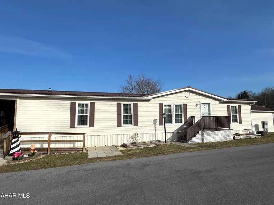 This home is in good condition.  Roomy with plenty of closet space including built-in pantry.  Some furniture stays.  The property is located on a corner rented lot includes deck, carport and shed.  The rent is $480 per month includes sewer.