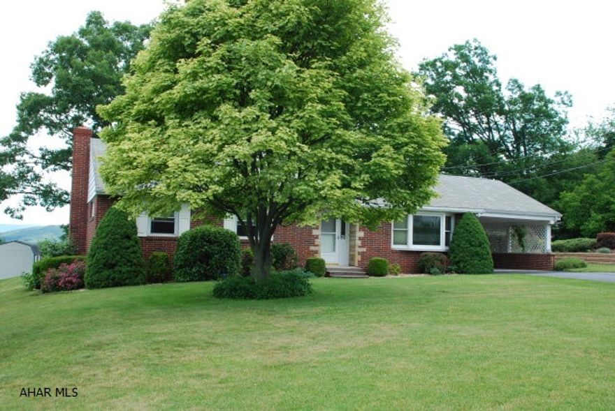 Brick home with carport. Newer oak kitchen, fireplace, oak hardwood floors, vinyl replacement windows, freshly painted.