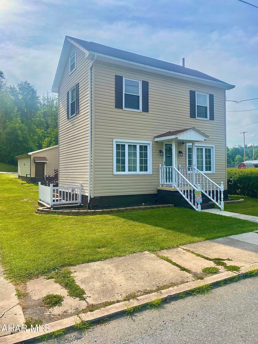 This beautifully updated home offers so much potential. Located in downtown Hyndman, PA, walkable distance to shops and a restaurant make this property a must-see! This affordable home is loaded with small-town charm and entertainment potential with the large rooms and lovely backyard deck. Call for more details.