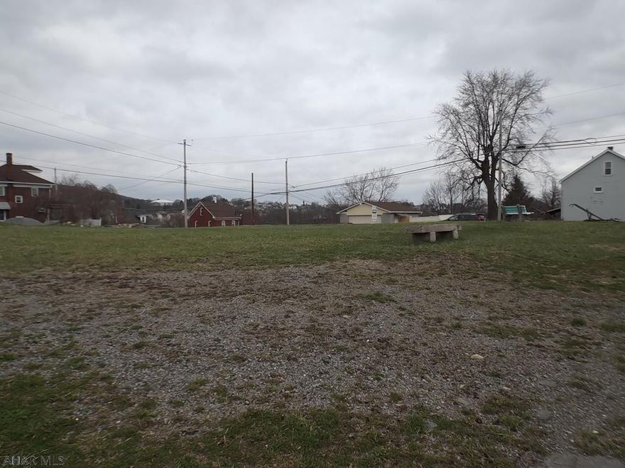 Level, city lot with water & sewer tap 250x120.