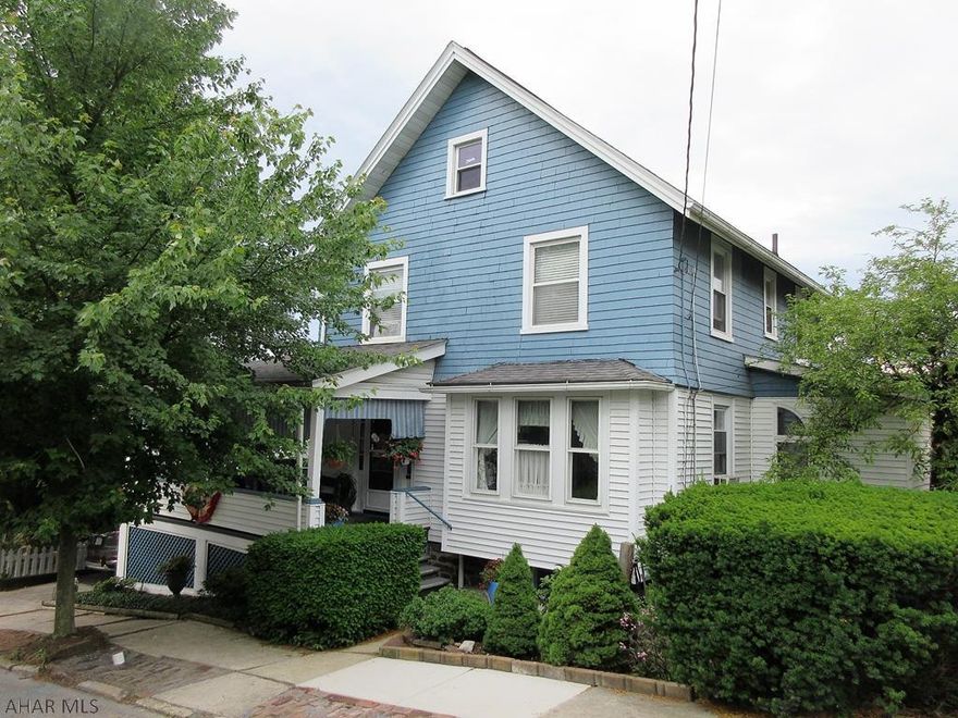 Lovely 2 story Hollidaysburg Borough home with so much warm charm and wonderful features throughout. Large living room with fireplace, spacious formal dining room and updated eat-in kitchen with stainless steel appliances plus large first floor bath with stand-up shower. Absolutely beautiful wrap-around front porch with awnings and private rear deck with built-in bar and grilling pavilion that is perfect for entertaining. 1 car carport plus updated furnace, electric circuit breakers. New sewer and gas lines in 2019.