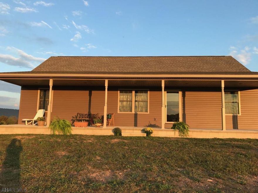 Looking for quiet country living but w/ a modern feel? This 2 yr. old ranch on 3+ acres delivers! Inviting is the word to describe the warm tones of the open floor plan w/ oak hardwood floors & cupboards and a large kitchen island for coffee & chats. Park your full size motor home in the garage & still have an equal amount of room for a workshop.- also a spacious office w/ workman's toilet, shower & washtub. The wide front porch beckons you to sit, stay awhile & just enjoy being home. Take your morning coffee on the back deck. It's hard to resist a view that rolls unobstructed down over fields, thru woods & up the mountains- changing w/ the seasons & the weather. Let nature's many faces enrich your life.