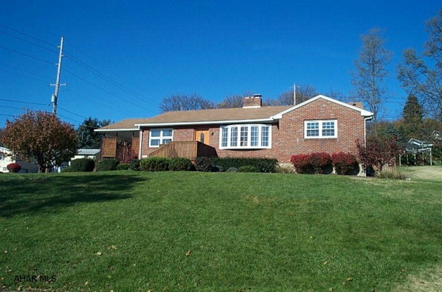 Classic Brick Rancher with Master Bedroom Suite Addition - 3BR/2.5BA - Finished basement includes wet bar & Media Room and half bath - cherry kitchen - oak hardwood floors - 2 furnace & A/C Systems - 2 carports.