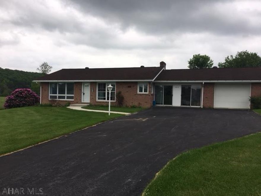 Brick ranch with mountain views and flat lot! Improvements include windows (2010), kitchen (Imler's), walkway (2013), refrigerator (2014), washer / dryer (2015), breezeway doors (2014), front storm door (2005), 30 year roof (2007), living room carpet (2012), garage door (2002), paved drive and small shed with 2017 roof.