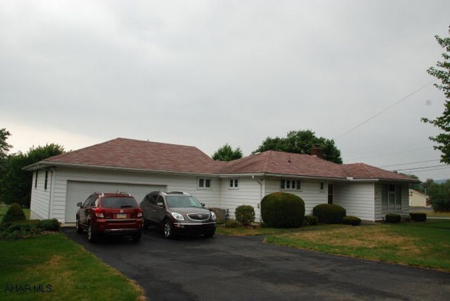 full finished basement, parquet hardwood floors, new windows, newer roof, attic fan, central air, 2 car oversized garage, wood stove. Dining room was a bedroom.