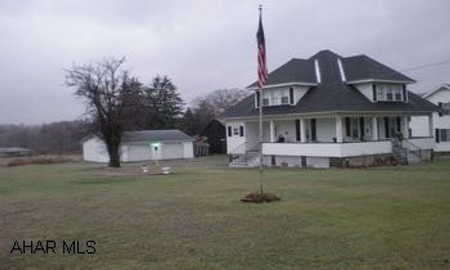 Attractive 1.5 story home with oversized 2 car detached garage. Subject to short sale with bank approval.