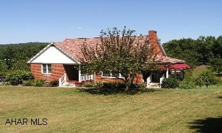 Immaculate and totally updated 1.5 Story Brick 4BR/2 1/2 BA with 1 car integral garage on large 1.63 acre lot. Side porch, rear deck, large garden, fruit trees, paved drive, new windows & doors. Large living room w/fireplace, loads of storage space