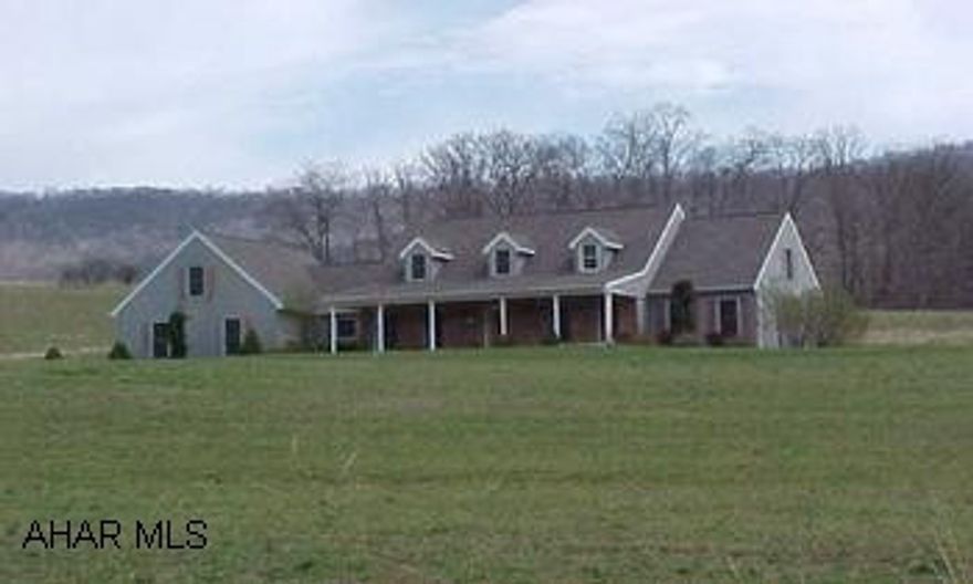 This home truly has lots of inner and outer space.  It offers five bedrooms, living room, family room, sitting room, dining room, kitchen and 2.75 baths.  This home was built in 1997 and rests on 14.5 gorgeous acres.  This property is offered "as is".  (Directions:  Route 30 West to Route 31.  Proceed straight through blinking light in Manns Choice for two miles.  Make a left onto Sulphur Springs Road, go 1.2 miles to left on Milligans Cove Road.  Go 1/2 mile to house on the right.)