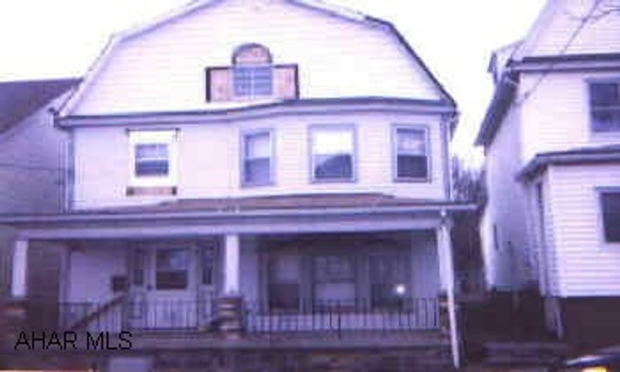 Large 4 bedroom home with finished and heated attic, could be 5th bedroom, new oak kitchen, new carpet, first floor laundry room.