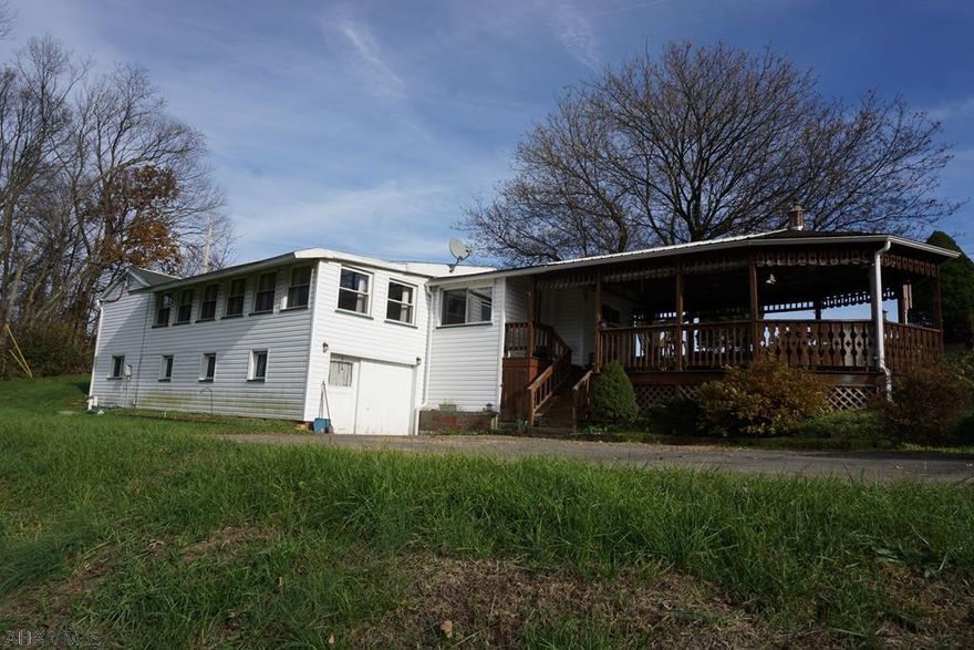 Cute starter home on 0.49 acres located in Williamsburg School District. This home features 2 bedrooms with a newer kitchen. Watch the sun rise in your living room through a large bay window or enjoy time on the covered porch. There is also a detached garage with a work space area.