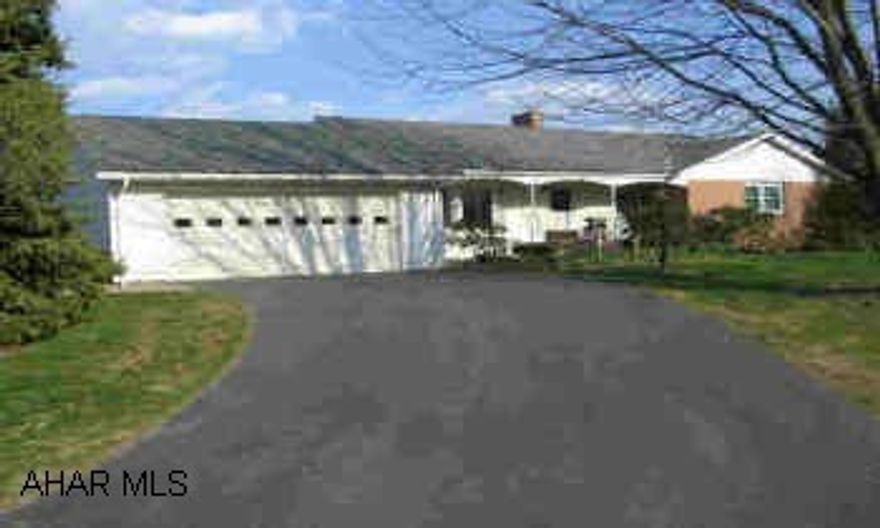 Vinyl/Brick ranch with spectacular views, large living room with fireplace, sunroom with skylights, vaulted ceilings. Heat pump has oil back-up and wood back-up; addition added in 1989, additional 800 sq. ft. in finished basement.