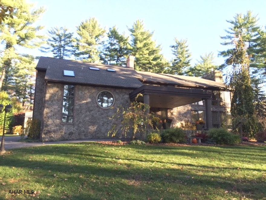 Custom built contemporary in Bellmeade/Logan Twsp. This four bedroom with 2.5 bath home features a vaulted ceiling, great room with wet bar and spiral staircase to second level. The formal dining room is large enough to accommodate many guests. The updated kitchen is open to the family room. All doors in the rear of the house open to magnificent pool area complete with granite top bar and of course a fireplace. No need to go inside, the pool house has room to change and a rest room.