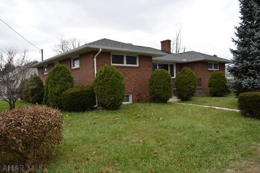 One story living with this beautiful brick ranch home in Hollidaysburg Borough. Hardwood floors throughout the living room (under the carpet) and three spacious bedrooms. The living room also has a cozy wood burning fireplace and large picture window. Enjoy the bright eat in kitchen with its birch cabinets and which leads to your private side porch. The level yard could easily accommodate off street parking or a garage. The roof, soffit and fascia were installed in 2010, the main service panel was just upgraded to 100 amp breakers (Nov/17) and a newer boiler was installed in 2011. A second washer hook up is available on the main level for easy one story living. Young Insurance Agency flood Insurance quote f $429.66/yr. Call today for an appointment to see this great home.