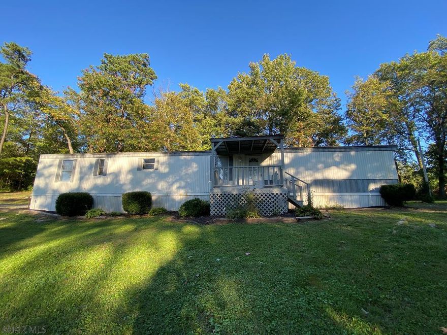 Sweet home in Breezewood park on just shy of 1.5 acres. Close to Breezewood and Mcconnellsburg. Privacy and easy access. Beautiful flat lot with tons of potential. Single-wide has updated interior with living room addition. Brand new carpets and flooring. Oil forced air heat with wood-burner in living room. Open concept living, dining and kitchen area. Roof recently sealed. All appliances included. Would make a perfect starter home or one floor living home. Property has two driveways, one facing Lincoln Highway and one facing Birch Road. Set up your showing today!