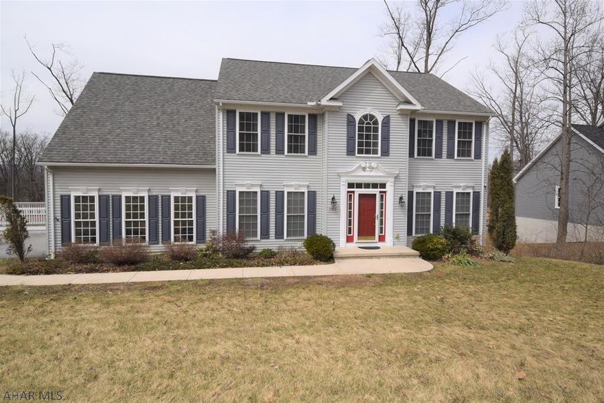 Lovely, spacious home in Brush Oaks development.  Hardwood floors, stainless appliances, second floor laundry.  Beautiful master suite with new master bath.  Finished basement has large family room, 3/4 bath, and bonus room that would be great for a home office.  Huge deck for outdoor entertaining with great view of the mountains.