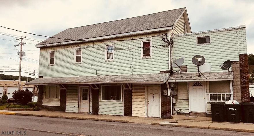 4 Unit Apartment  building . All units currently rented. Building is section 8 approved. 4 stove and 4 Frig. included with the sale. Great investment property. This property is priced to sell.