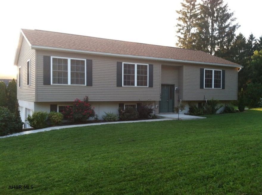 This beautifully maintained 3 bedroom, 2 1/2 bath, 2 car attached garage, raised ranch home is in move-in condition!  The main floor has a large living room, dining room, and eat-in kitchen with breakfast bar. Downstairs has a huge recreation room which walks out to a nice patio perfect for get togethers!  There is a wrap around deck off the dining room to sit and relax on in the evenings. Close to schools and downtown.