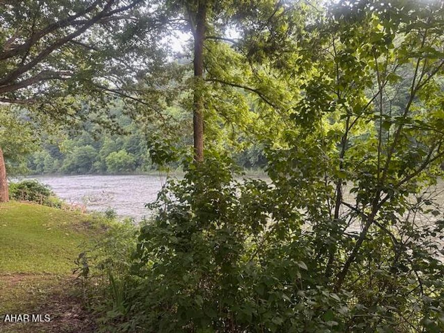 Enjoy this beautiful vacation spot bordering the Juniata River. Come to camp, RV , canoe, fish and just literally hang out. When the hustle and bustle of the city is getting to you and you need a quiet place in the country, this would be a great choice. This property has a well already drilled and electric is on the property. The picnic pavilion will offer many mountain memories. There is a cabin on the property that could be revamped and put to good use, but please do not try too access the building in it's current state..

PLEASE DO NOT TRY TO ACCESS THE BUILDING IN ITS CURRENT STATE!   UNSAFE STAIRS AND FLOORS!!

PLEASE DO NOT TRY TO PULL YOUR VEHICLE INTO THE CENTER OF THE LOT AS IF THE LAWN IS WET YOU WILL GET STUCK!!!