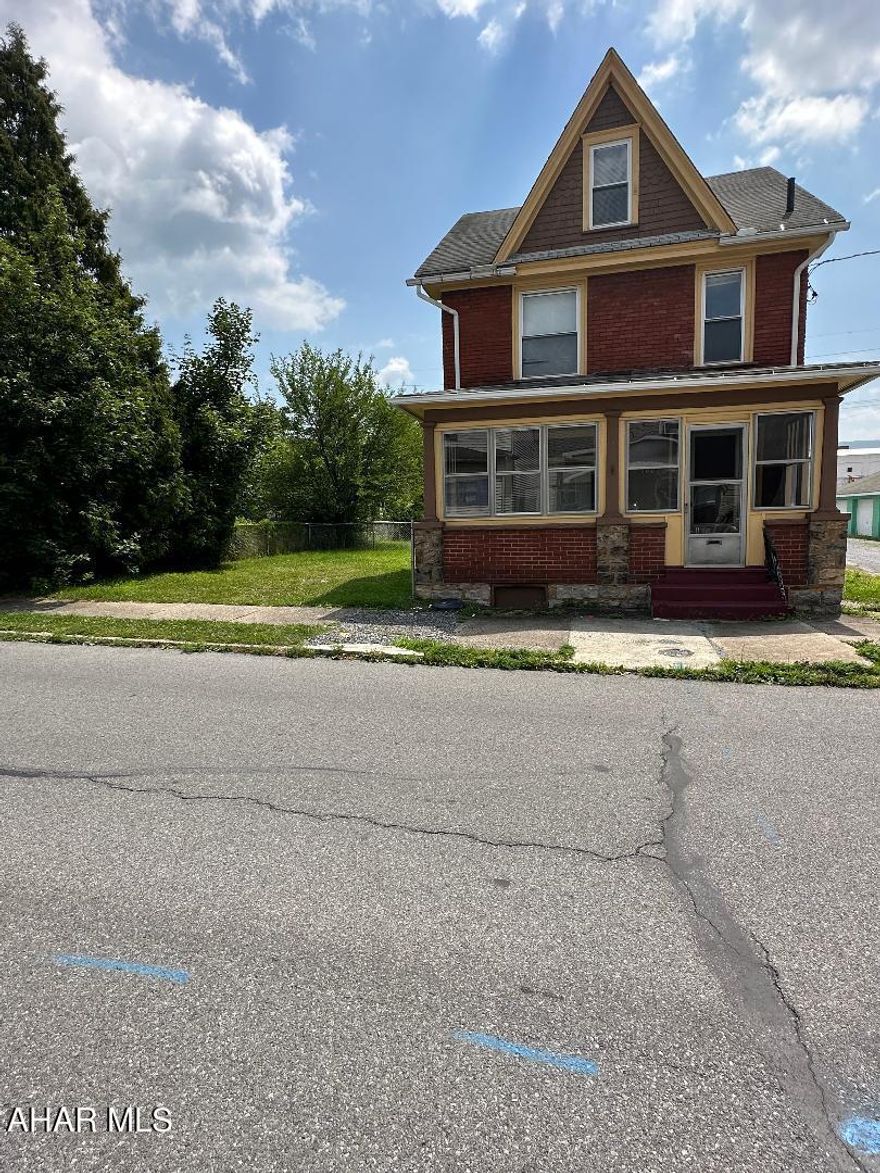 Investors!!! Previously used as a 4 bedroom student rental. Loads of potential. Lots of off street parking and a 1 car garage in the back.