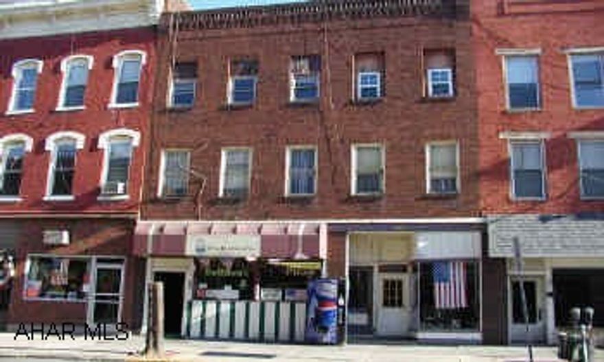 3 Story brick building with 3  apartments, first floor commercial.  Hullihan's pizza and sandwich shop was the most recent business.  Business closed.  No equipment.