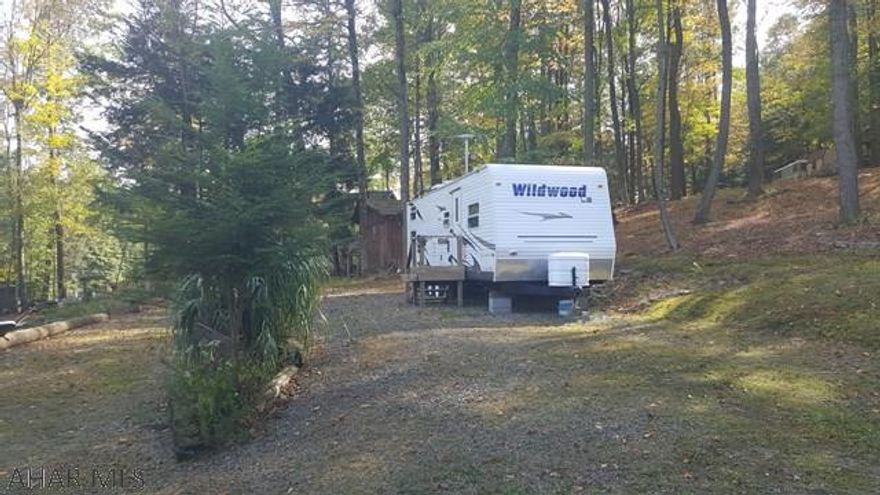 2008 30' Wildwood T camper on two beautiful lots in Glendale Yearound. These two lots are setup and ready to be used yesterday. Perfect for the outdoorsman. The camper can sleep 10 so there's room for the whole family and even extended family. There are two sheds on the property with electric run to both. One is setup as a rustic kitchen and the other as a workshop/mancave. Glendale Yearound is a gated community minutes from Glendale Lake and Prince Gallitzin State Park. Community Pool, Security, Basketball, Tennis, and more.