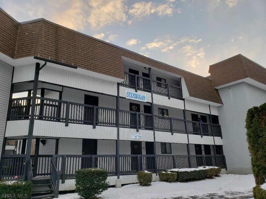 3rd-floor fully-furnished 2-bedroom 2-bath condo with woodburning fireplace & balcony.  Electric system is breakers.  $256/mo HOA dues include: road & outside maintenance, outdoor pool, hottub, + tennis court usage.  4-seasons resort:  Golfing & skiing for a fee. J-463