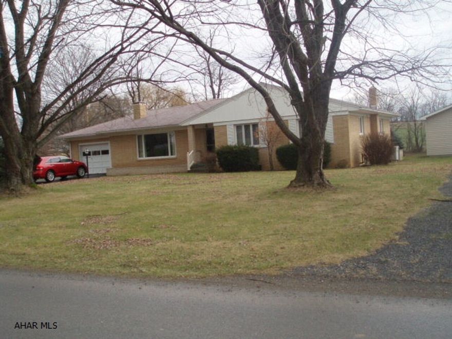 Very nice brick rancher on over 1.5 acres, 2 fireplaces oil heat with heat pump and central air.  1 car attached garage and 1.5 car heated detached garage.  Quiet stream running through property.