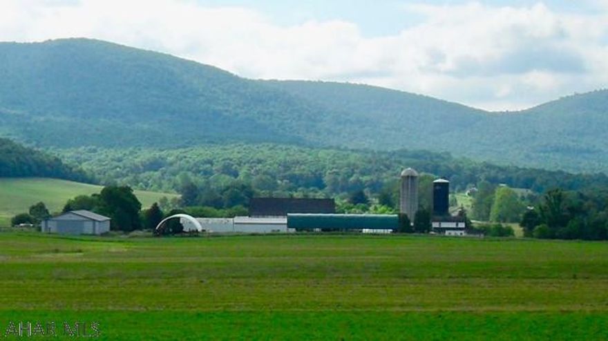 Operational dairy farm with 350+/- acres with a lovely restored farm house, and additional farm house providing housing for guest and/or employees. Milk house & parlor, barn, storage buildings, 123 free stalls, manure pit, heifer barn, Morton Building and 240 tillable acres, 20 pasture acres & 90 wooded acreage with good value. Also includes the possibility of purchasing an additional adjacent 55+/- acres along with additional farm of 170+/- acres for a total of 575+/- acres.  Click on drone video for more details on land.
