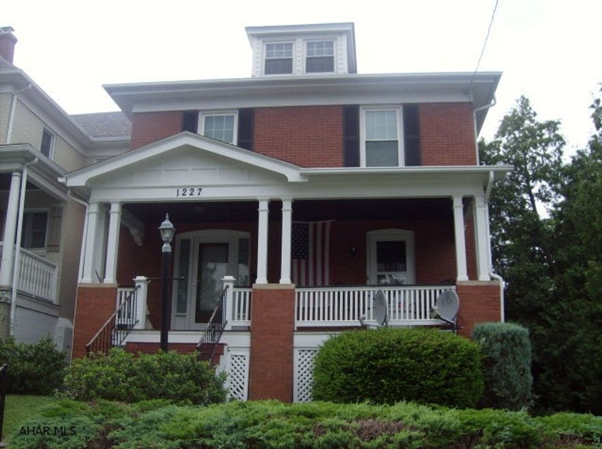 Stately two story brick home with many updates.  Newer windows and roof.  Spacious!