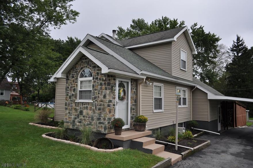 Beautifully maintained and updated 4 bedroom 2 bath home in Hollidaysburg Area School District. This home is move-in ready featuring cathedral ceilings in the living room, beautiful newly refinished hardwood flooring through the living room, dining room & kitchen, and a great cemented outdoor entertainment area with pergola, string lights, & lattice work next to a large flat yard with 2 sheds. The kitchen is completely updated with all stainless steel appliances and a new custom-made kitchen island included. The upstairs bedroom features vaulted ceilings and the master bedroom features newly installed luxury vinyl flooring, trim, and a custom-made wood wall. Home also features a whole-house generator.