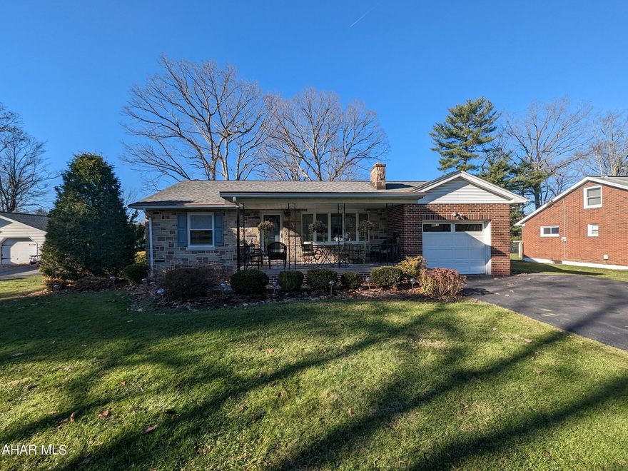 Absolutely adorable Bellmeade 1 story brick and permastone home on nice, level lot in Bellwood School District! Features large formal living room w/ hardwood floors and stone FP, spacious eat-in kitchen w/ SS appliances, enclosed rear sunroom plus 3 bedrooms and 1 bath all on the 1st floor. One car attached garage w/ opener just off kitchen. Finished, walkout basement could be separate living quarters w/ family room, 3/4 bath, full 2nd kitchen, storage room w/ cedar closets, workshop/utility room. Gas HW heat plus central air. Attic w/ pull down stairs for storage.  Beautiful front covered porch and storage shed. Better check it out!