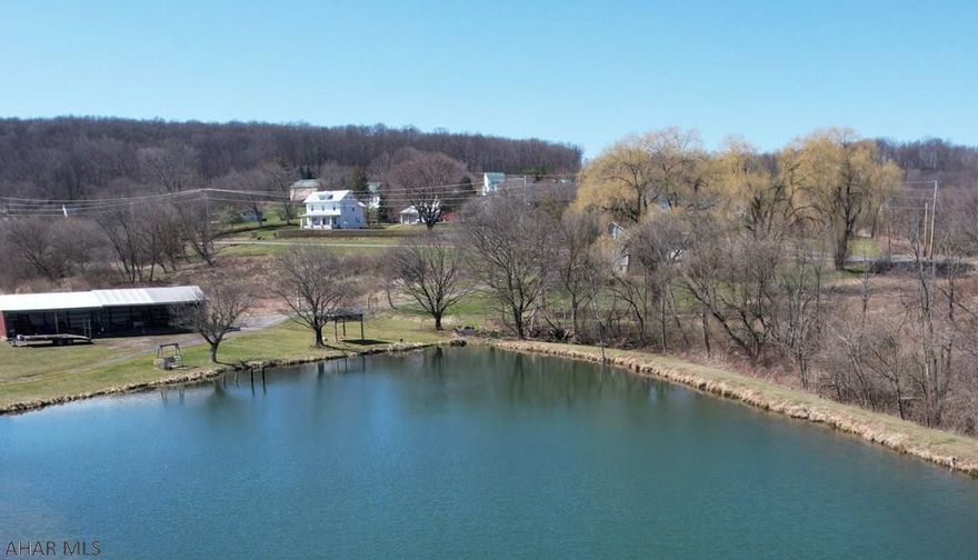 Bedford County is home to incredible farms and this is no exception. 155 +/- acres (73 tillable, 47 wooded, 26 pasture, 2 building acres) of mostly flat farmable land and great hunting ground.  Enjoy the peaceful views of the large pond surrounded by wonderful vistas from the spacious renovated farm house complete with master suite with walk in closet and private bath.  A 2 bedroom apartment (960 sq ft) is found above the workshop. The barn is in very good condition as are the outbuildings & 5 car garage.  Farm consists of 2 story bank barn 88'x80', Milk House 10'x17', Frame Garage 24'x24', Pole Building 16'x44', Pole Building 20'x30', Machine Shed 18'x50', Machine Shed 11'x12'.  Located within easy access to the Pennsylvania Turnpike, Interstate 99 and Lincoln Highway.