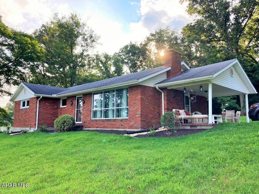 Brick ranch home in desirable Snake Spring Twp. Lovely yard, inviting porch and peaceful setting. 3 bedroom, 1 bath on 1+ acre. Hot water oil heat, cental a/c, hardwood floor. Nice outbuilding. Close to amenities.
