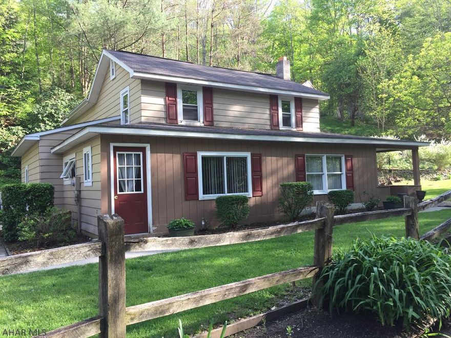 Adorable 3 bed, 2.5 bath starter home on half an acre in Spring Cove school district!  Plenty of living space to sprawl and tons of storage!  First floor has a fairly open floor plan.  Master bedroom is HUGE with a 3/4 bath, walk-in closet, and sunroom with balcony.  Sunroom used to be a jacuzzi room - Could easily be turned into an office, another walk-in closet, exercise room, or back into a jacuzzi room!  Lots of yard space for kids to play.  3 bay carport next to the house and additional garage up the hill behind the house.