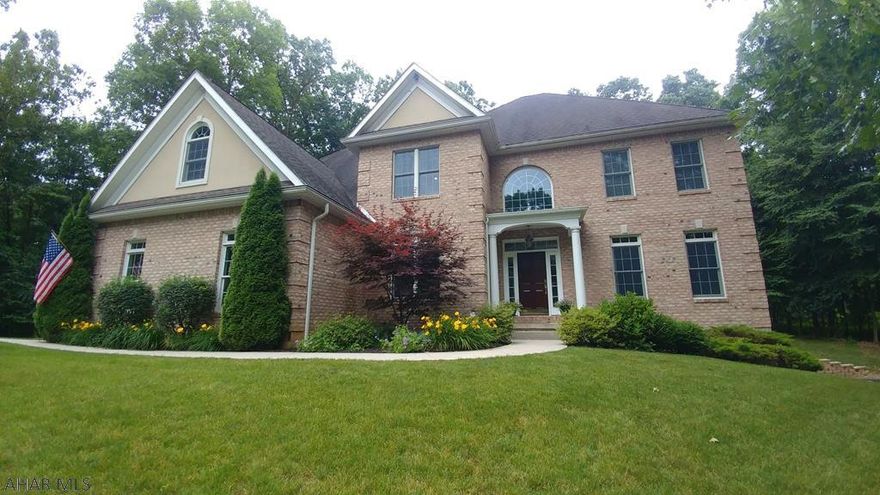 Luxurious Warriors Mark home in a beautiful setting! 5 BR 4+2 BA stunner has over 4000sf of living on 2+ wooded acres. 2-story entry with French doors and transom windows on left and right leading to private office and dining room, above is a dramatic second floor open railing. Step down into the family room with wood burning fireplace flanked by windows showcasing the private rear yard. Kitchen is the heart of this home - granite counters, custom cabinetry, island with seating, prep sink, double oven and more.  Beautiful hardwood throughout the main level. Upstairs, your master suite - spacious, lots of light, tray ceiling. French doors to master bath with all of the features you love, and a jetted tub for 2! 2nd floor also features living room with a cozy fireplace!