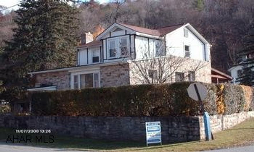 2-Story frame house with hand-cut native stone. 2-Story frame house with hand-cut native stone on level, corner double lot. New windows, newer roof. Beautiful stone house with stone retaining wall.  Close to school.