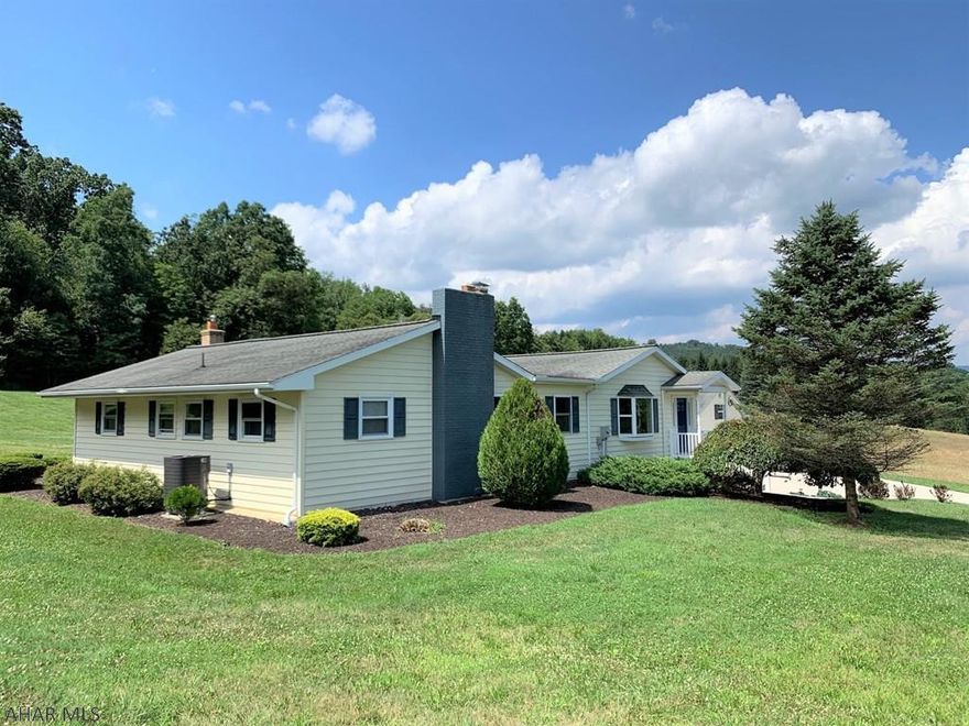 Beautiful, well appointed ranch home resting on 3.3 acres! Main level offers a LR w/ picture window, double bulkheads w/ recessed lighting, updated kit w/ oak cabinets & tiled floor, DR w/ oak floor, owner's suite w/ dual walk-in closets & en suite bath, two additional bedrooms, a full bath, half bath, two office suites, & a stellar heated/cooled sun room to enjoy natural country views. Walk-out basement w/ loads of room for storage, heat-pump w/ oil back up & central air & 2-car integral garage. Sizable, detached garage w/ workshop w/ heat & air to take-on any project you need to tackle - full walk-up loft for storage or could be finished into additional custom space. Additional detached garage w/ 2-car carport. Well landscaped, concrete driveway & walks, & a very relaxing rear patio.