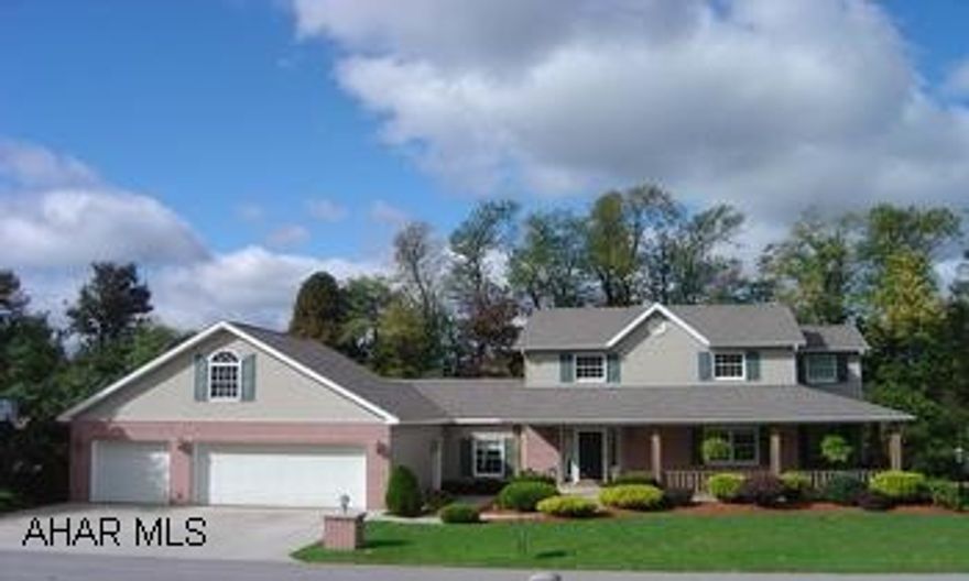 2 story, 4 br, 2.5 baths, 3 car attached garage with lots of extras. 15x18 country kitchen with hardwood floor. Quiet dead end street, home in very good condition. 2,240 sq' living area + 13x22 room unfinished bonus room over garage. 34x20 wrap around porch. 3 car heated garage, large family room, unfinished basement with drains for future bath and much more.