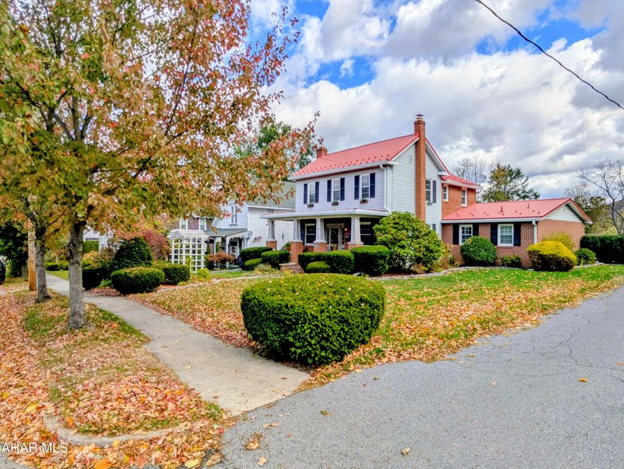 Come see this charming Colonial home where timeless character blends perfectly with modern luxuries. The landscaped front yard offers a warm welcome, leading into a wonderful living room with a wood-burning fireplace and built-in shelves. The kitchen opens right into the dining room, making it easy to cook, chat, and entertain all at once.

Upstairs, you'll find three inviting bedrooms and a newly renovated full bath. Custom built-in accents throughout the house add a touch of charm and personality. On the main floor, there's a full bath and laundry area conveniently located just off the attached garage.

The private backyard is perfect for relaxing or hosting friends, featuring a new patio, pergola, fresh landscaping, and a black fenced yard with gates and added privacy between neighbors. There's plenty of parking with a circular driveway in front and extra space off the back alley—great for a camper, trailer, or boat. Two sheds provide even more storage or space for hobbies.

You'll love the location—walking distance to downtown Bedford, the Elks Golf Course, and the Heritage Trail. Plus, it's just a short drive to I-99, I-70, and the PA Turnpike, and about two hours from Pittsburgh, D.C., Baltimore, or Harrisburg.