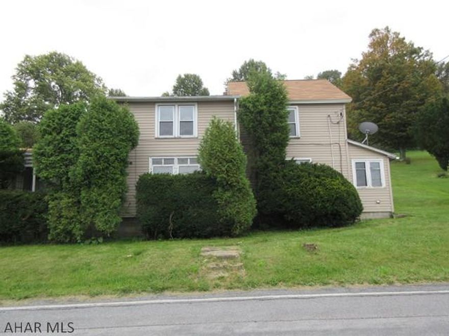 Patton area 2 story vinyl home on large lot. Some nice updates including newer bath, but needs some work. Large eat-in kitchen and spacious living room, first floor laundry/half bath, 2 car attached garage and large covered rear patio. Property sold AS-IS. Seller will make no repairs. Offers must be submitted through HUD approved broker. Buyer pays both transfer taxes. Equal Housing Opportunity.