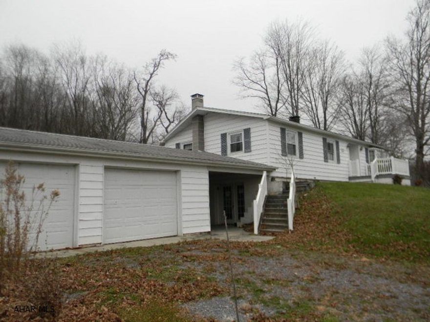 Impressive 3 BR, 1.75 BA vinyl ranch situated on 1.55 acres with 2 car attached garage and full, partially finished walk-out basement. Beautiful oak galley kitchen, central air, basement rec room, garage workshop. Offered AS-IS, immediately available!