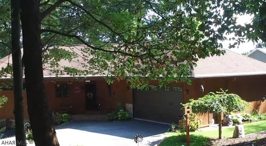 This amazingly unique ranch home with walk out basement sits on a beautifully landscaped wooded lot.  It has stunning features such as first floor living, floor to ceiling Pella windows with extraordinary mountain views, exceptional wood accents, master suite with heated floors in the bathroom, guest bath with a champagne jetted clawfoot tub, walk-in showers and so much more!  The kitchen has tons of storage and views into the wooded backyard.  You won't want to leave this outstanding master suite.  It is the perfect oasis!  The indoor open concept and outdoor area are ideal for entertaining.  The spacious unfinished basement has been plumbed for future finishing and is a blank canvas for it's new owner.  Attached two car garage is remarkably clean with polymer floors.