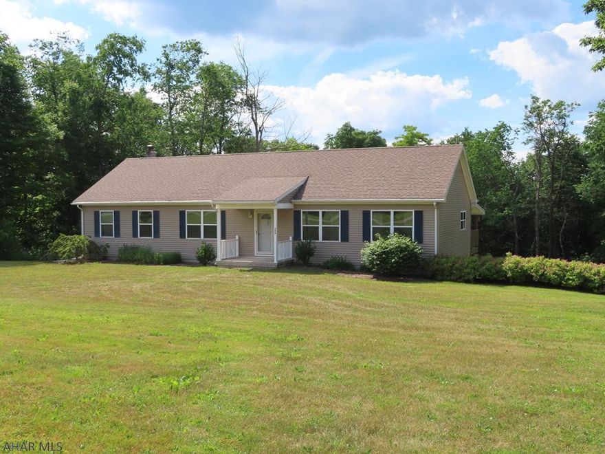 Great setting!  Over 9 acres of nicely wooded land with great views.    This ranch home is ready for you to move into!  It features 3 bedrooms, 2 full baths, a living room and a bonus recreation room!   The rear deck offers a place to relax, entertain or just enjoy the views - which include a view of a nice size, mostly level backyard.   There is a full basement with this home that offers a lot of potential.   The uses for the 24' X 36' Oversized Detached Garage are Endless !   Big Bear Lane is a private Roadway that is maintained by the residents on the private roadway, no maintenance agreement in place.