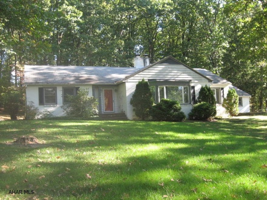 Spacious ranch home in a great location, Warrior Oak Subdivision.  Large lot - .77 acres. New Anderson windows, furnace, water heater, air conditioning, garage doors and openers. Sunken living room has brick fireplace with pellet stove, huge bay window, hardwood floor and 9' ceiling.  Dining room has a built-in corner cupboard and bookcases on each side of the window, hardwood floor, plus french doors to a slate patio.  Kitchen had a re-do of new dishwasher and countertop; has nice eat-in area with a big window to the back yard; large pantry; lots of cabinets.  Three nice-sized bedrooms with lots of windows and large closets. New bath with slate floor, wainscoat, Corian vanity top and attractive shower unit. 23x19 covered back porch.