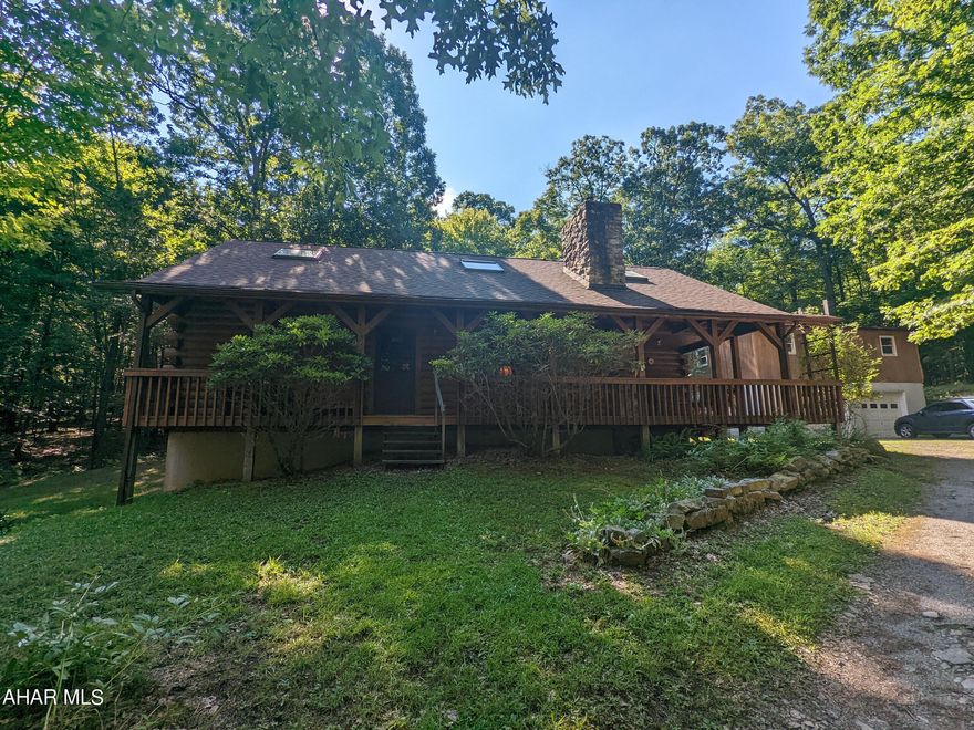 This unique Asperline log home on 18.9 private acres in desirable Bellemeade area offers complete privacy and wooded seclusion. Features living room with stone FP w/ wood burner insert, vaulted ceiling with exposed natural wood beams and skylights. Total of 4 bedrooms, 3 baths includes 2 very large bedrooms on second floor w/ vaulted ceilings, exposed beams and skylights. Large eat-in kitchen plus formal dining room, large rear sunroom plus finished walk-out basement w/ full bath and 3 very large rooms for many possible uses. Large, relaxing covered front porch and side deck, 2 car detached garage w/ walk up stairs to loft/workshop w/ commode that could be easily converted to possible apartment or separate living quarters. Sip coffee and watch the local wildlife from your large, rear sunroom or front covered porch, but still a few quick minutes from shopping and town. You really can have it all here! New roof 2019. Part of Clean and Green preferential tax assessment program.