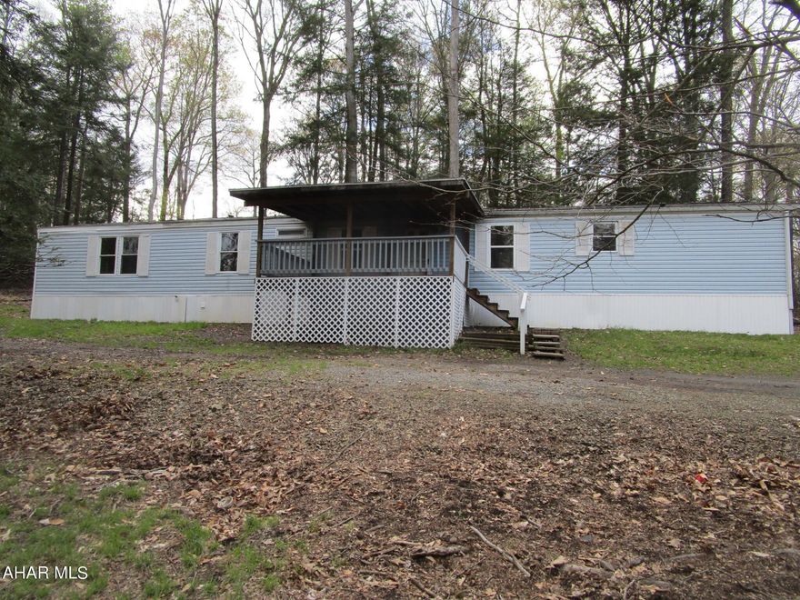 This mobile home would make an economic home or getaway.  Three bedrooms, one is small; two bathrooms, large kitchen / dining area on over 1/3 acre lot in Glendale Yearound.  New flooring throughout.
The mobile home has a title.  The back bedroom / bath was destroyed by a tree and has been rebuilt.
Being sold as is.