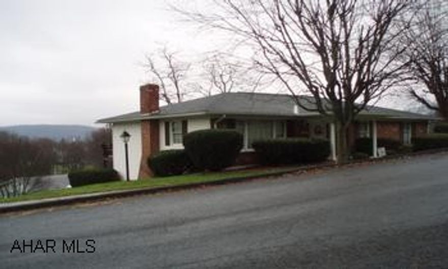 Spring is right around the corner, time to move into a well built ranch built by Kilcoin; close to town on a dead-end street.  Walk out from the dining room onto the back 8'x12' deck. There is a breakfast bar in kitchen and 3 roomy bedrooms w/lighted closets.  Lower level has a large family room with a stone fireplace, wet bar, 1/2 bath & laundry.  The FR walks out onto the paved driveway for great summer fun.  The FR has real "barn wood" walls.  Nice sized laundry room with double wash tubs & wood cabinets.  25'x26' integral garage. This is a fabulous deal!  Minutes from I-99, Turnpike, & the Bedford Springs Resort.  Call Patty @ 814-285-0314 to set up your showing ASAP.  Two additional lots for sale for $59,000 each.  Lot 7F includes the out building.